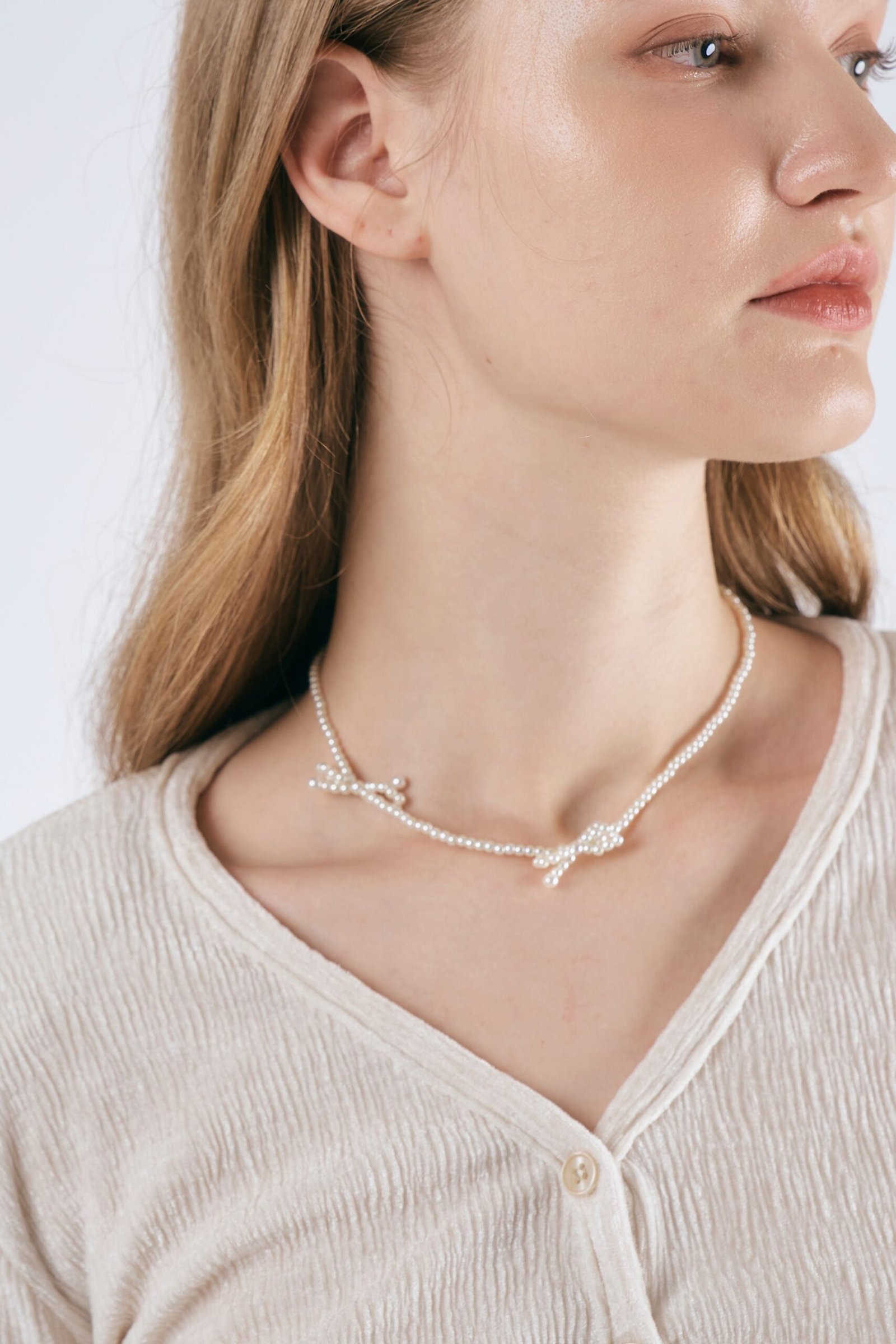 FauxPearlBowNecklaces_02-scaled-1.jpg Faux Pearl Bow Necklaces - Image 1